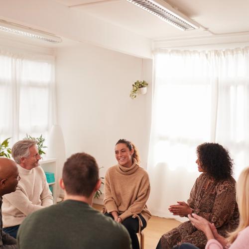 Woman speaking in a support group session